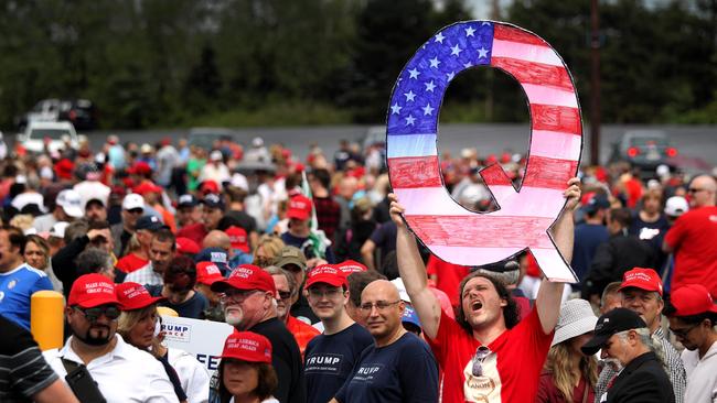 David Reinert holds up a large ‘Q’ sign while awaiting the arrival of US President Donald Trump at a rally in Pennsylvania. Picture: AFP