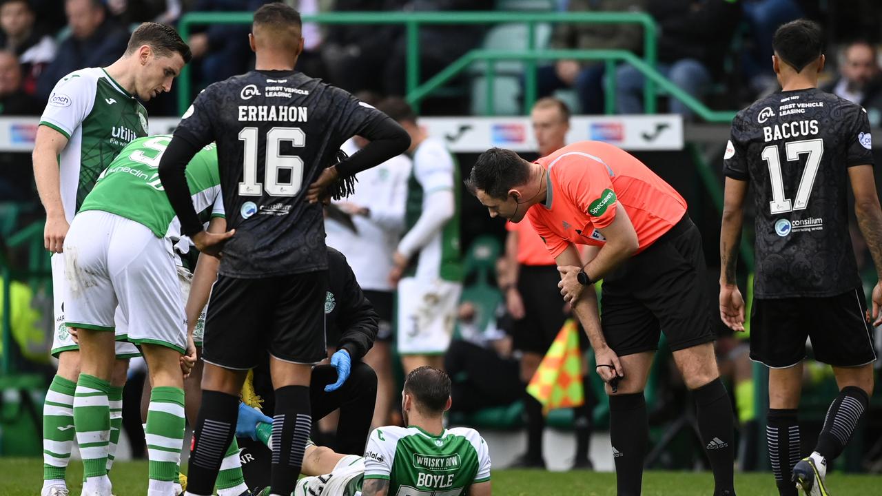 Martin Boyle goes down injured in a Scottish Premier League match.