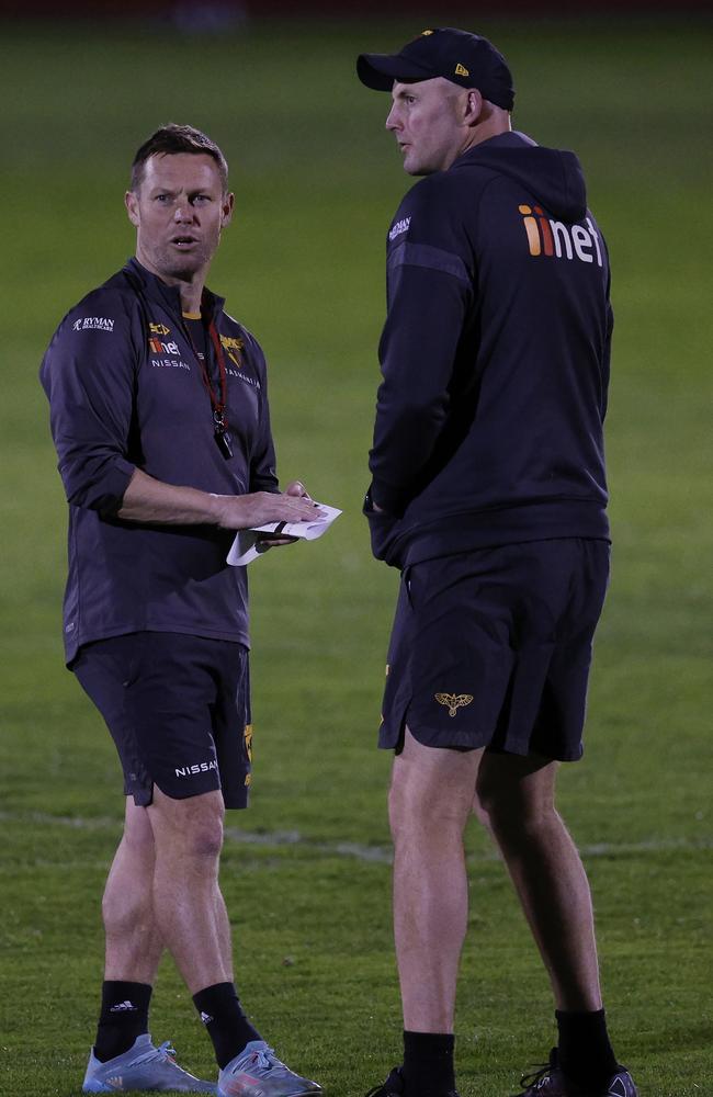 Hawthorn coach Sam Mitchell (left) and midfield assistant David Hale at the Hawks’ special night training session at Punt Road last Friday. Picture: Michael Klein