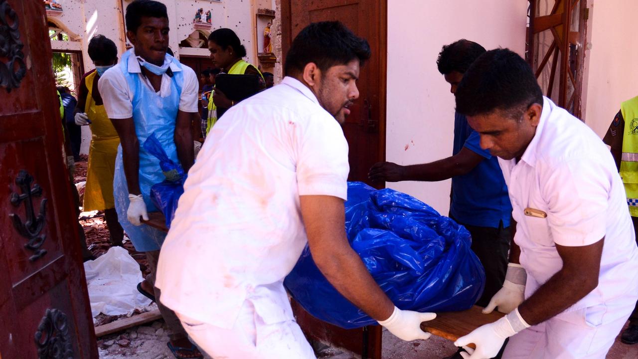 Bodies are being carried from St Sebastian's Church at Katuwapitiya in Negombo on April 21, 2019, following a bomb blast during the Easter service. Picture: STR/AFP