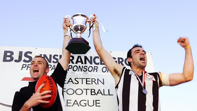 Kristian Bardsley (L) raises the 2006 premiership with Scoresby. Picture: STEVE TANNER