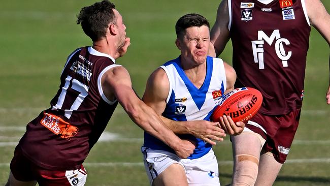 Melton’s Lachlan Hickey can’t stop Daniel Toman of Sunbury. Picture: Andy Brownbill