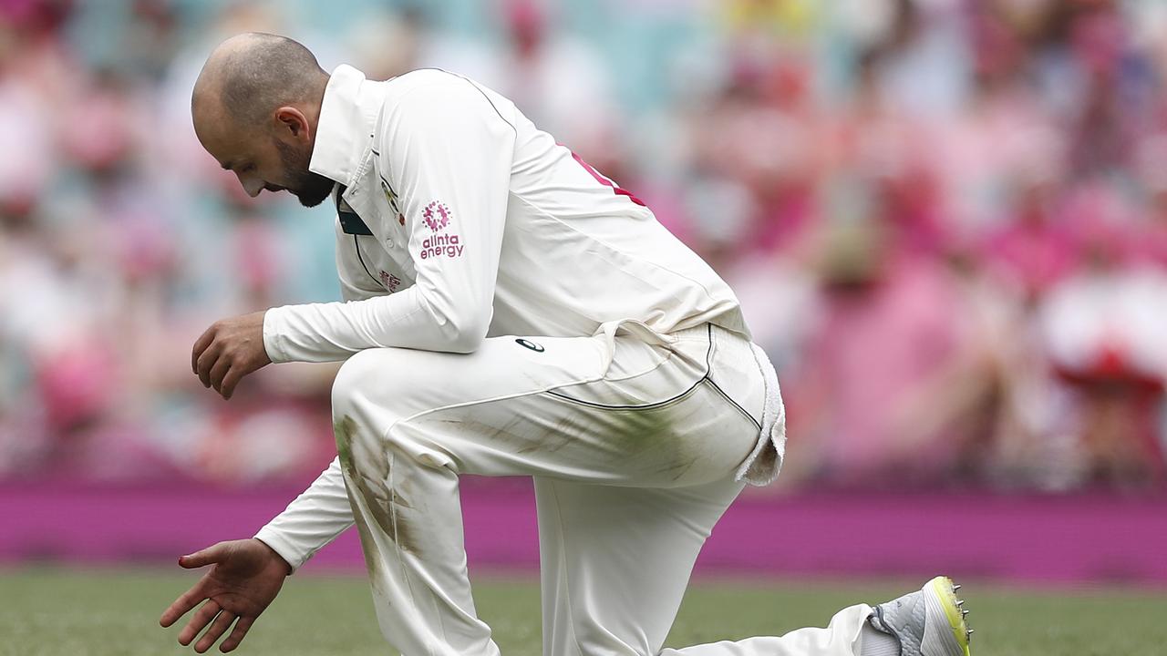 Nathan Lyon injures his thumb while fielding off his own bowling during day three.