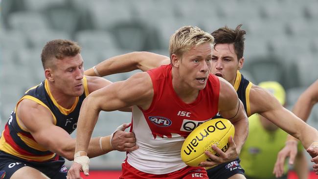 AFL – Adelaide Crows v Sydney Swans at the Adelaide Oval. Isaac Heeney under pressure from Rory Laird and Jake Kelly Picture SARAH REED