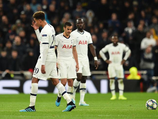 Tottenham Hotspur's English midfielder Dele Alli (L) reacts after conceding their fourth goal during the UEFA Champions League Group B football match between Tottenham Hotspur and Bayern Munich at the Tottenham Hotspur Stadium in north London, on October 1, 2019. - Bayern won the game 7-2. (Photo by Glyn KIRK / IKIMAGES / AFP)