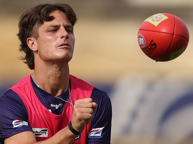 PERTH, AUSTRALIA - MARCH 18: Neil Erasmus handballs during a Fremantle Dockers AFL training session at Victor George Kailis Oval, on March 18, 2022 in Perth, Australia. (Photo by Paul Kane/Getty Images)