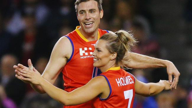 Mathew Richardson of the All Stars and Abbey Holmes celebrate a goal during the EJ Whitten Legends match at Etihad Stadium in September. Picture: Michael Dodge (Getty Images)