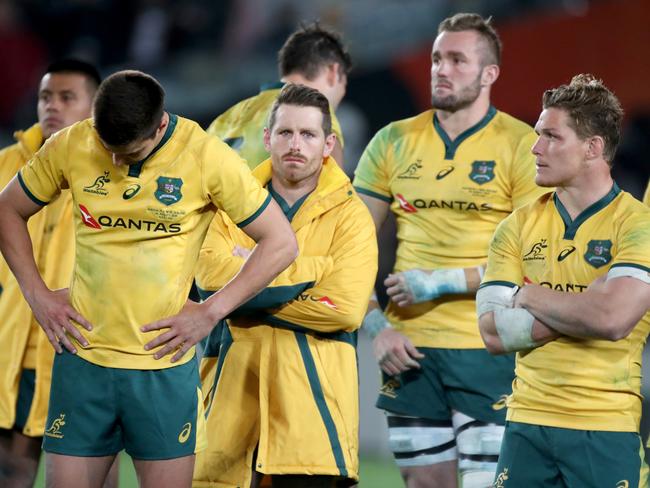 Jack Maddocks, Bernard Foley, Izack Rodda, and Michael Hooper look dejected after the loss. Picture: AAP