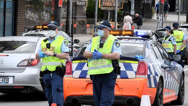 Police at the checkpoint in St Peters on Saturday, deterring people from joining a potential protest in the CBD.