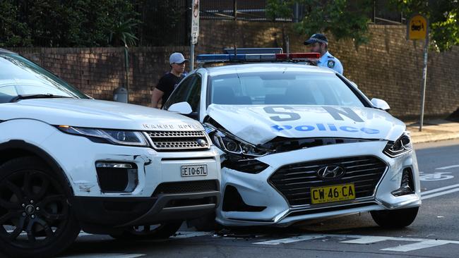 A damaged police car and Range Rover on Jenkins St at Chatswood. The alleged drifver of the Range Rover, Rhys Evans, was in Manly Local Court to face 17 charges. Picture: John Grainger