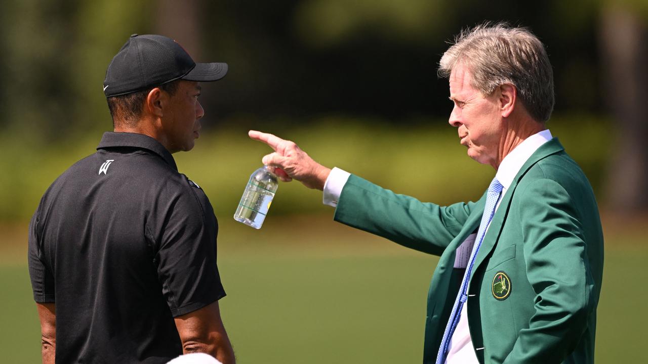 Fred Ridley, chairman of Augusta National Golf Club, greets Tiger Woods in the practice area prior to the 2023 Masters Tournament. Picture: Ross Kinnaird/Getty