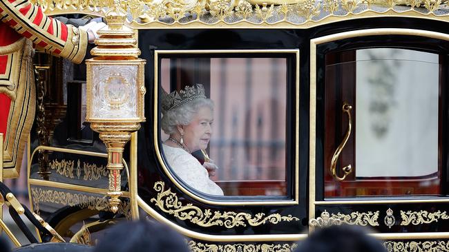 Queen Elizabeth II returns to Buckingham Palace in the new Diamond Jubilee state coach following the State Opening of Parliament on June 4, 2014 in London. Picture: Getty