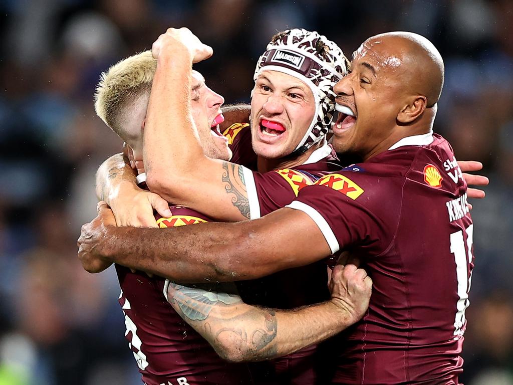 Cameron Munster, Kalyn Ponga and Felise Kaufusi celebrate after claiming victory in Game 1 of the 2022 State of Origin series. Picture: Getty Images