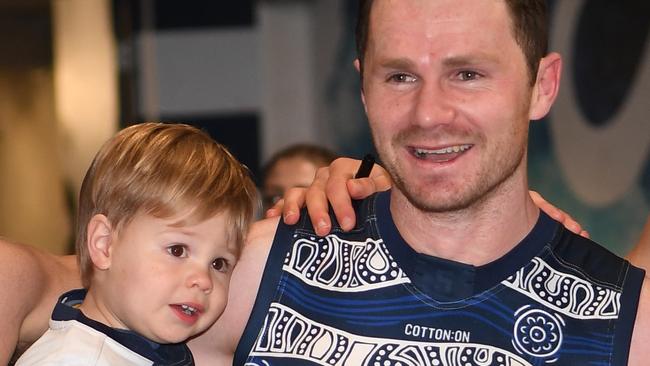 Patrick Dangerfield enjoys Geelong’s win with his son George. Picture: AAP Image/Julian Smith.