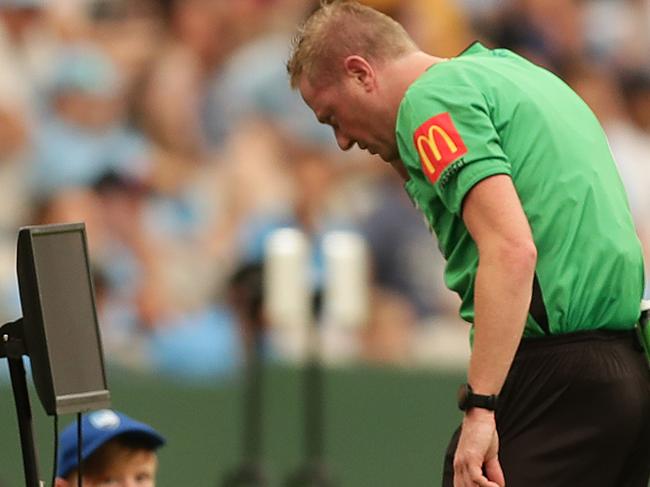 SYDNEY, AUSTRALIA - DECEMBER 29: The referee consults VAR before deciding to give Rhyan Grant of Sydney a red card during the round 12 A-League match between Sydney FC and Melbourne City at Netstrata Jubilee Stadium on December 29, 2019 in Sydney, Australia. (Photo by Mark Metcalfe/Getty Images)