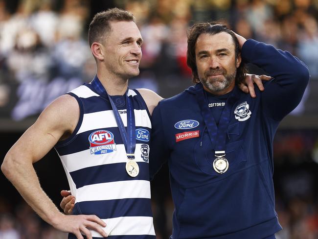 MELBOURNE, AUSTRALIA - SEPTEMBER 24: Joel Selwood of the Cats and Cats head coach Chris Scott celebrate winning the 2022 AFL Grand Final match between the Geelong Cats and the Sydney Swans at the Melbourne Cricket Ground on September 24, 2022 in Melbourne, Australia. (Photo by Daniel Pockett/AFL Photos/via Getty Images)