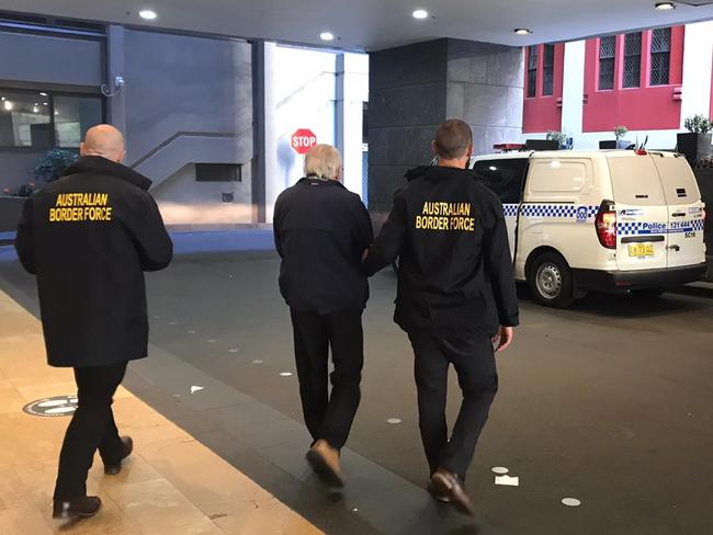 Australian Border Force investigators arrest a Sydney man on child abuse offences after raiding his hotel room where he was quarantining after returning from the US.