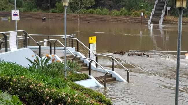 Constant rain has blocked off access to the banks of the Parramatta River near the wharf.