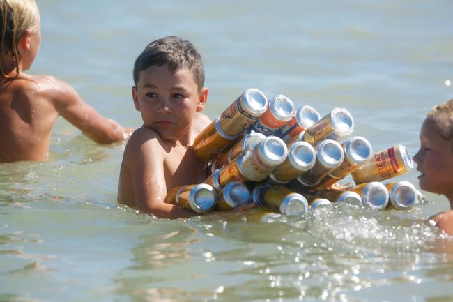 One young player gets a head start on next years boat at the 2019 Beer Can Regatta at Mindel Beach. Pic Glenn Campbell