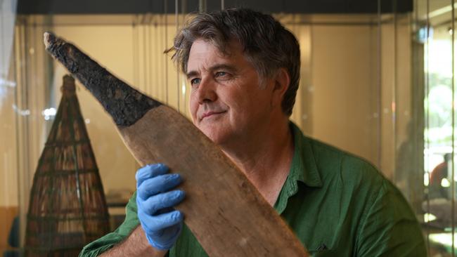 Associate Professor Westaway holds one of two extremely rare rainforest swords, discovered in Queensland. Picture: Lyndon Mechielsen