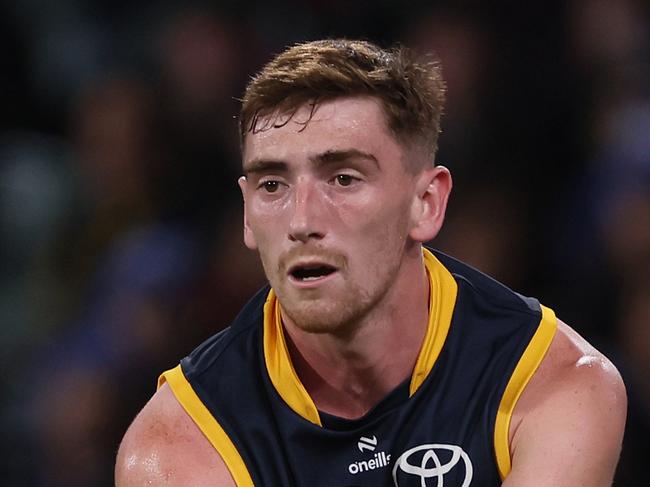 ADELAIDE, AUSTRALIA - JUNE 06: Mark Keane of the Crows handpasses the ball during the 2024 AFL Round 13 match between the Adelaide Crows and the Richmond Tigers at Adelaide Oval on June 06, 2024 in Adelaide, Australia. (Photo by James Elsby/AFL Photos via Getty Images)