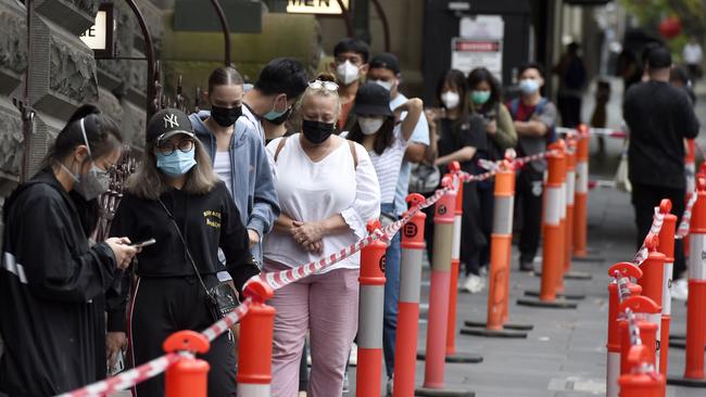 MELBOURNE, AUSTRALIA - NewsWire Photos JANUARY 7, 2022: People queue for Covid tests at the Melbourne Town Hall. Picture: NCA NewsWire / Andrew Henshaw