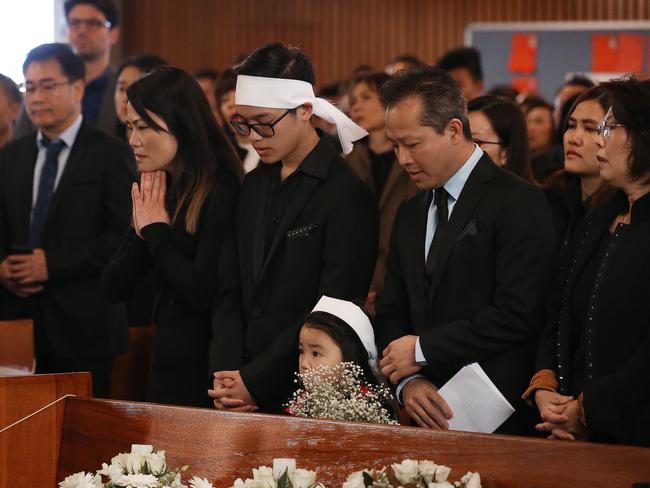 Jason Nguyen’s family (with this father on the right) at his funeral. Picture: Sam Ruttyn