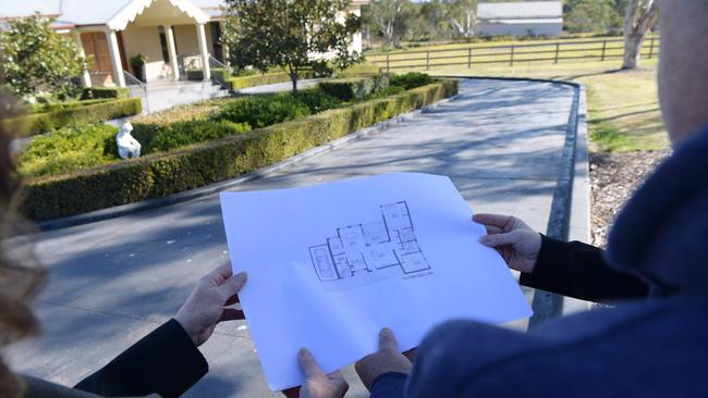 Hills Councillors Robyn Preston and Mayor Michelle Byrne with landowner, Mr Rocco Polistina looking over his D/A on his Annangrove property. Picture: Simon Bullard