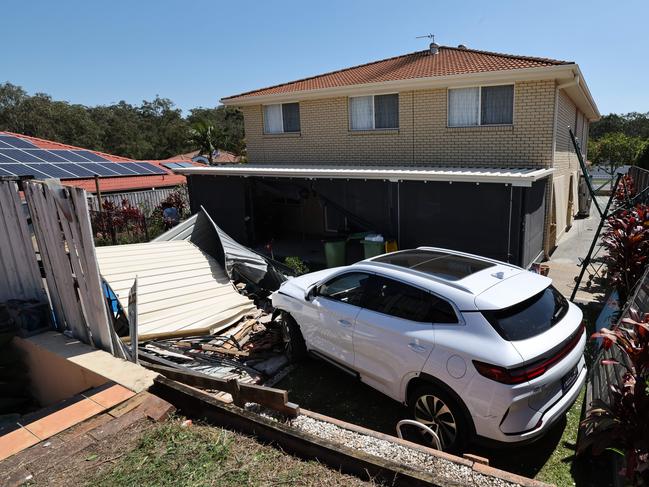 The BYD car where it finally came to rest at the back of a neighbouring property. Picture: Glenn Hampson.