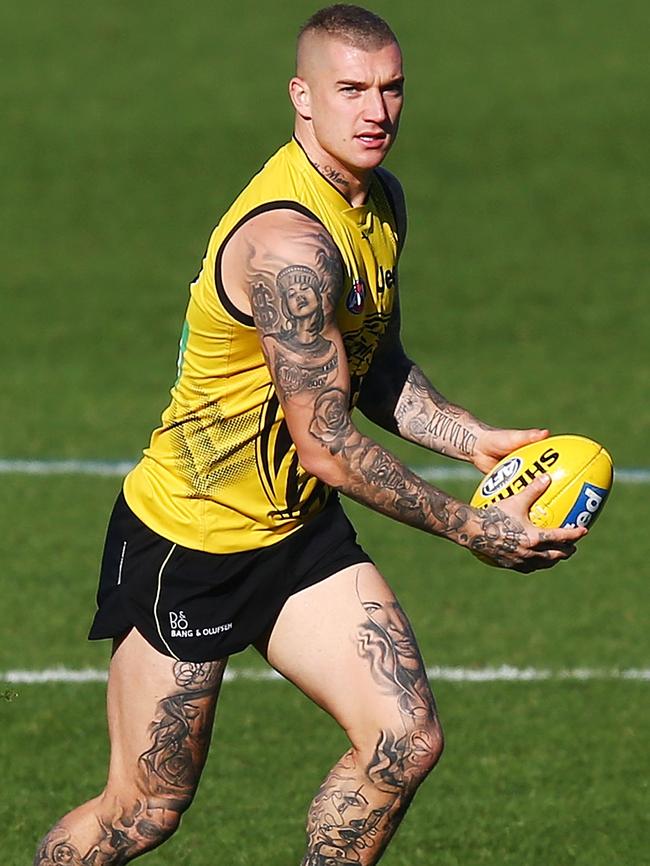 Dustin Martin will try to overcome a calf injury to play against Geelong.