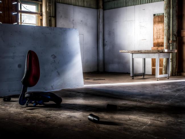 Discarded furniture is sprawled across the building.