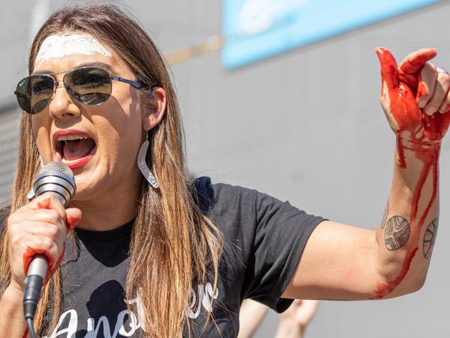MELBOURNE, AUSTRALIA - SEPTEMBER 22: Deputy Leader of the Greens in the Senate Lidia Thorpe speaks to the crowd with mock blood on her hands on September 22, 2022 in Melbourne, Australia. Indigenous groups have held 