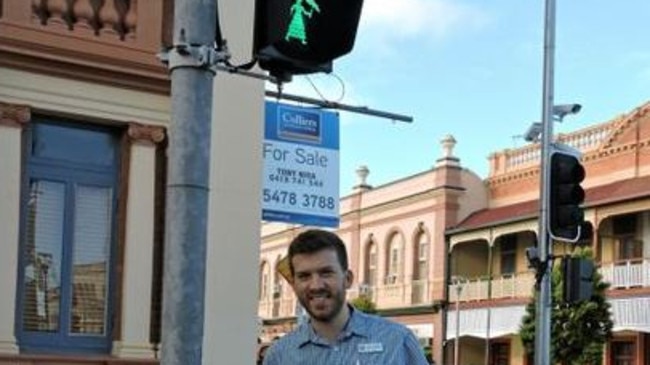 Cr Paul Truscott with one of the operational lights in Maryborough.