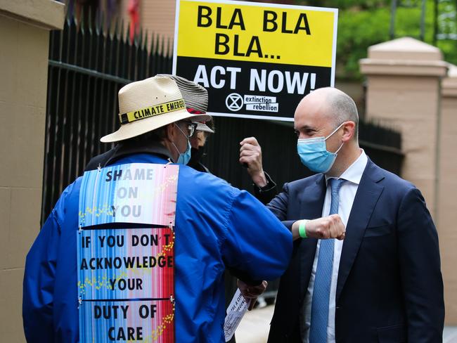 Treasurer Matt Kean chats to protesters outside NSW Parliament. Picture: Gaye Gerard