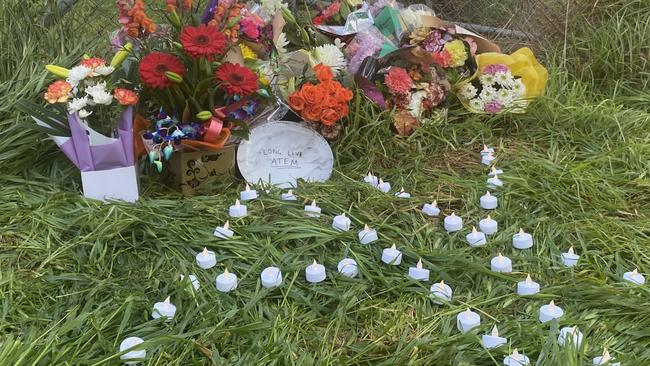 Floral tributes left at the scene of a fatal car crash at Edinburgh RAAF base. Picture: Todd Lewis