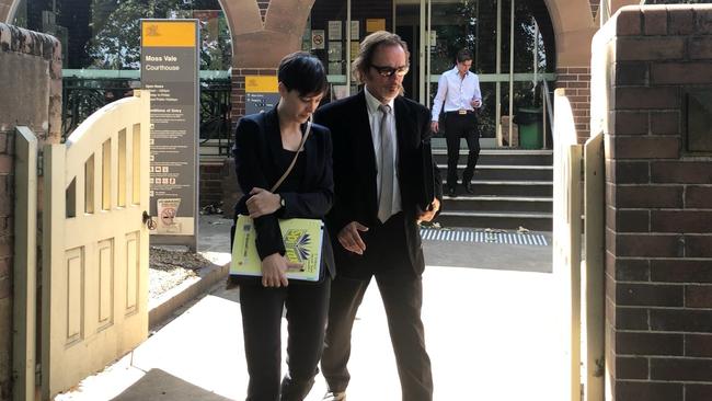 Ulf Werner Astleitner-Kaiser (right) leaves court with his lawyer.