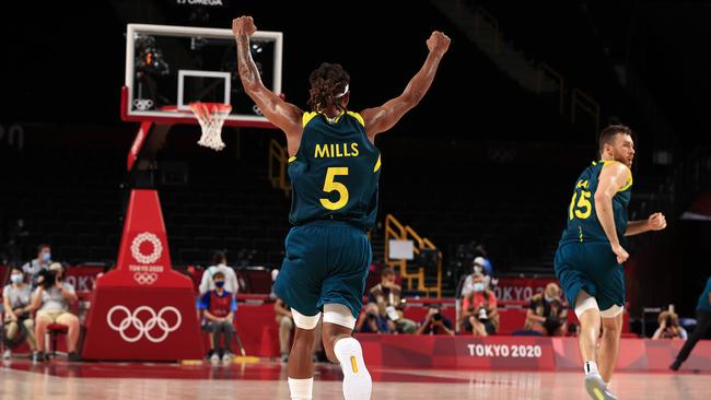 Patty Mills celebrates winning the bronze medal playoff. Picture: Adam Head