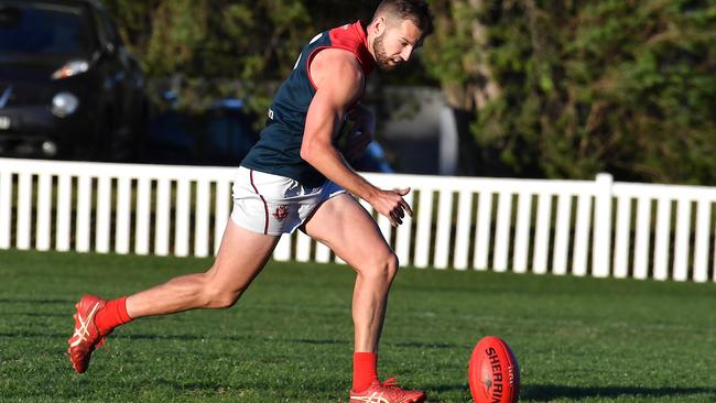 Surfers Paradise player Kain Ford takes a bounce QAFL Aussie rules match between Mt Gravatt and Surfers Paradise. Saturday July 17, 2021. Picture, John Gass