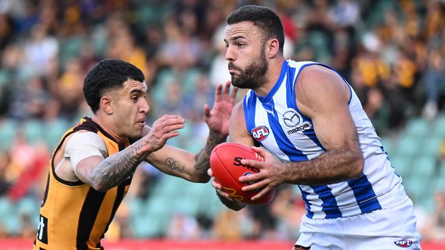 Alastair Clarkson says Griffin Logue made a split second decision to protect his own head when he collided with Will Day against Hawthorn on Saturday. Picture: Steve Bell / Getty Images