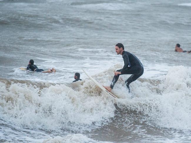 Top End Monsoon Surfing at the Nightcliff Beach, Darwin. Picture: Pema Tamang Pakhrin