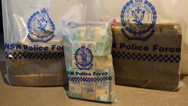 Police seized more than $8 million in cash while raiding several homes.