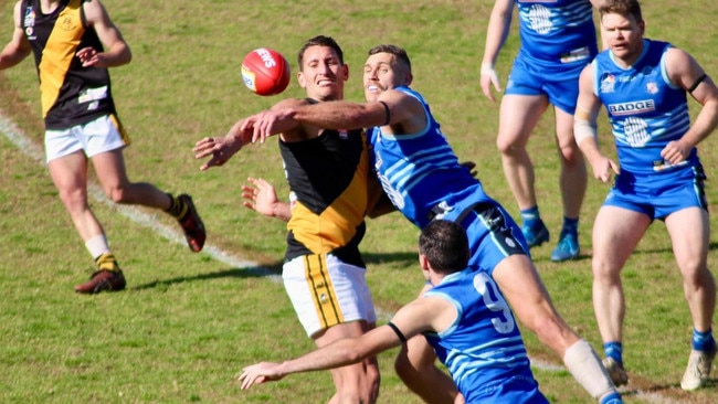 SHOC's Alex Cailotto battles Broadview's Jesse White in last year's second semi-final. Picture: SHOC Football Club