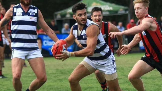 The classy Chris Annakis skips away from a would-be tackler. Picture: Davis Harrigan