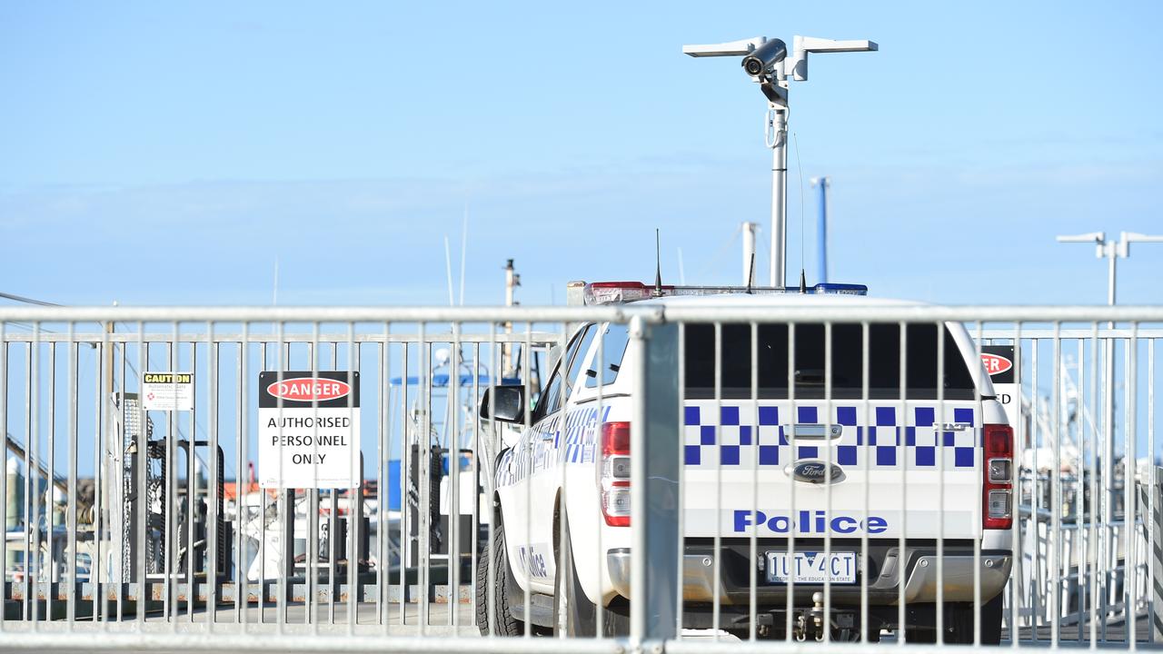 Police at the scene of Portarlington Pier after a man drowned when he fell from a fishing boat. Picture: David Smith