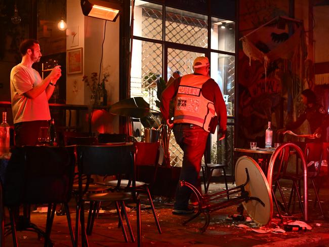 Tables are overturned on a sidewalk after a stabbing that left several people wounded in Tel Aviv, Israel. Picture: Getty Images