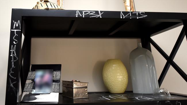 Gang signs drawn on furniture inside the Werribee house. Picture: Nicole Garmston