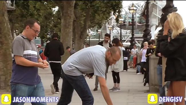 Several men stopped to drop some change into her cup. Picture: YouTube