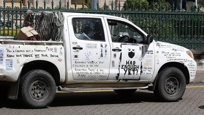 A car with slogans painted on it at the protest. Picture: NCA NewsWire / Josh Woning