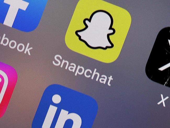 CHICAGO, ILLINOIS - FEBRUARY 05: In this photo illustration, a Snapchat app is shown on February 05, 2024 in Chicago, Illinois. Snap, the parent company of Snapchat, announced today it plans to lay off 10 percent of its global workforce. (Photo illustration by Scott Olson/Getty Images) (Photo by SCOTT OLSON / GETTY IMAGES NORTH AMERICA / Getty Images via AFP)