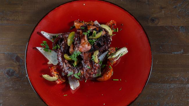 General view of a grilled octopus legs and semi-dried tomatoes dish that is served at King Tea. (AAP Image/Renae Droop)